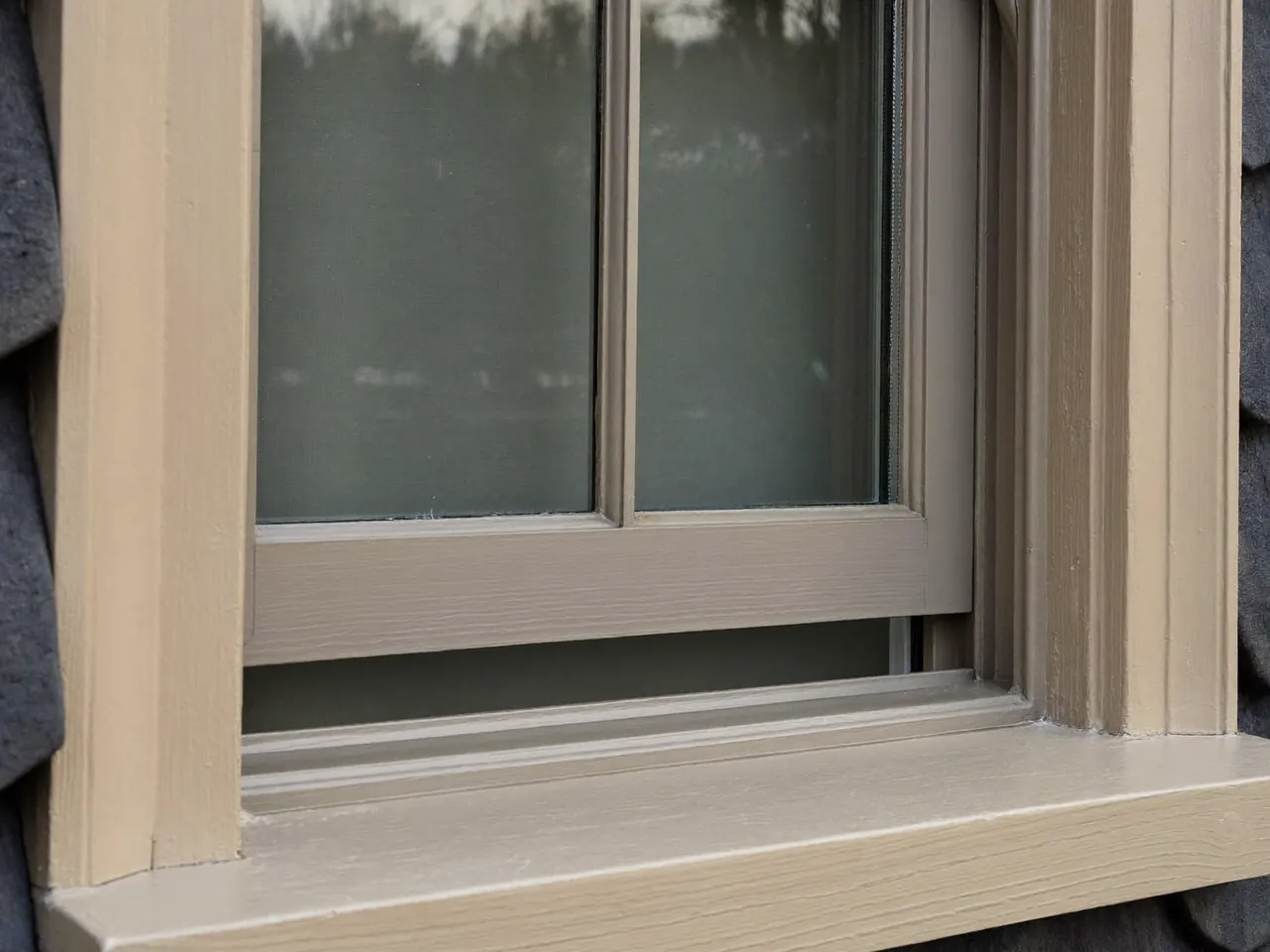 Flush casement window sitting level with the frame on a cottage wall