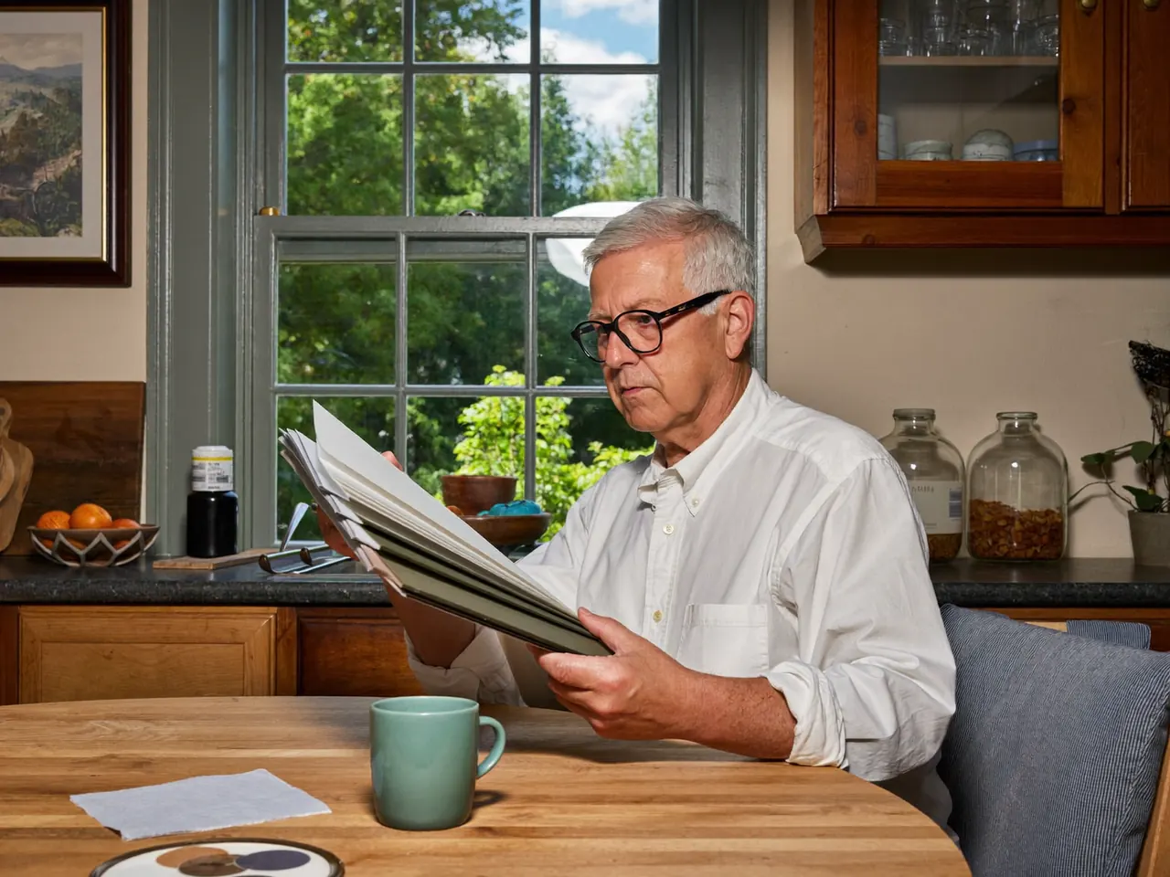 Homeowner comparing window frame colour swatches at a kitchen table
