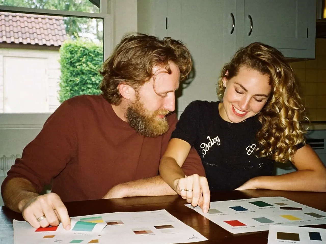 Homeowner reviewing a printed double glazing quote at home