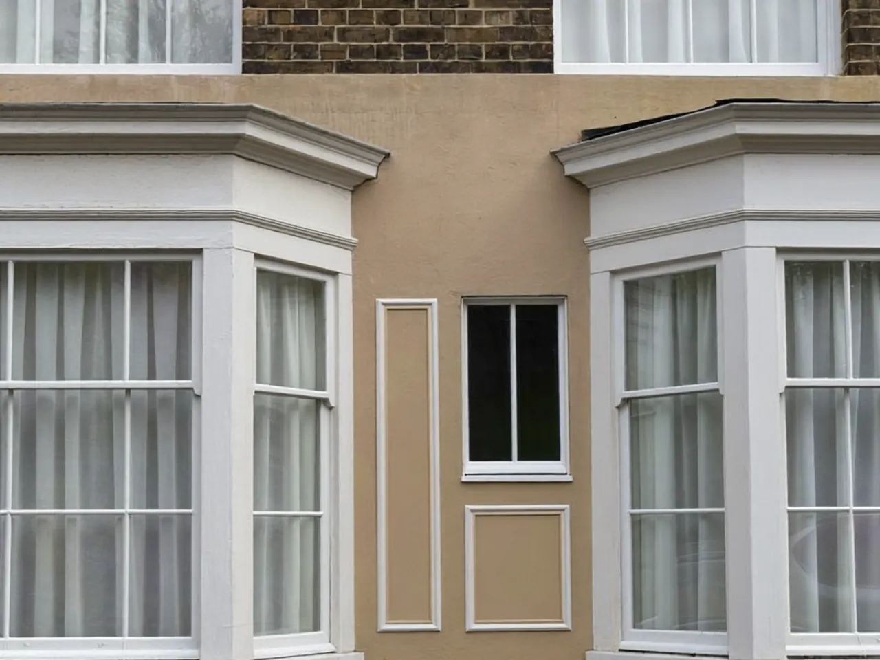 Close-up of a painted timber window showing natural wood grain