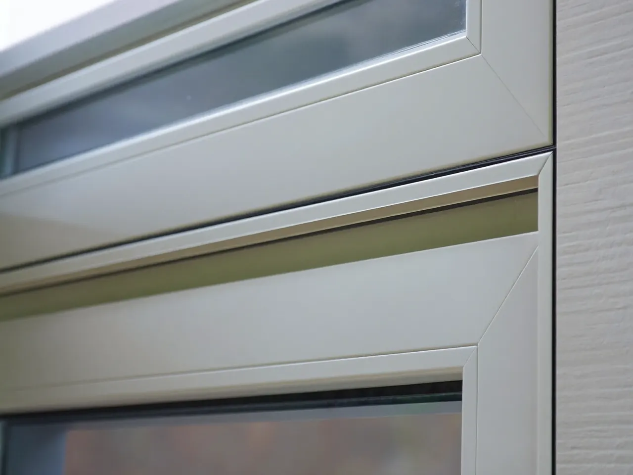 Close-up of a white uPVC window frame profile and multi-chamber section