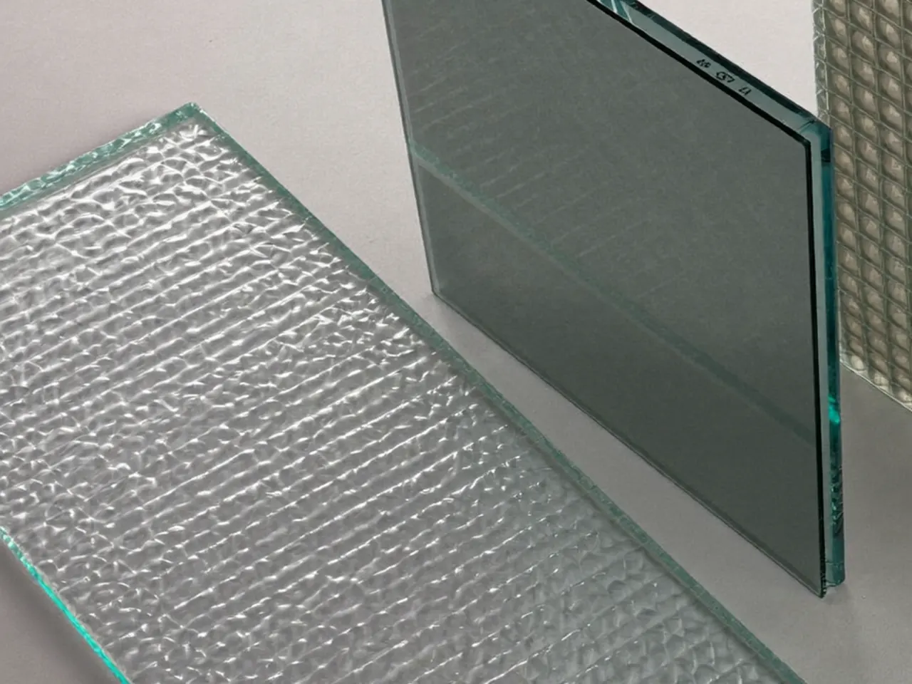 Edge of a sealed double glazing unit showing the spacer bar and two panes